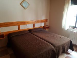 Hostal Arenal客房内的一张或多张床位