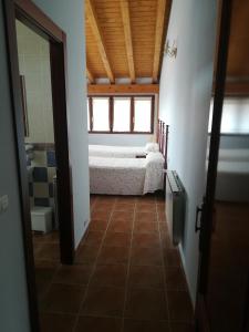 Łóżko lub łóżka w pokoju w obiekcie Casa Rural GAUBEKA
