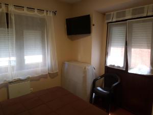 Hostal Arenal客房内的一张或多张床位
