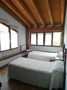 Łóżko lub łóżka w pokoju w obiekcie Casa Rural GAUBEKA