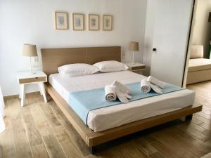 A bed or beds in a room at Alegria Kefalonia