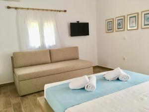 A bed or beds in a room at Alegria Kefalonia