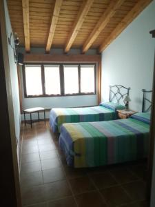 Łóżko lub łóżka w pokoju w obiekcie Casa Rural GAUBEKA
