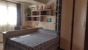 a bedroom with a bed in a room with a window at Villa SportLife in Lloret de Mar