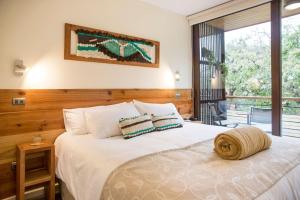 Postel nebo postele na pokoji v ubytování Maki Hotel