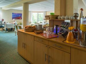 a kitchen with a counter with food on it at Alte Schmiede in Ostseebad Karlshagen