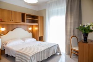 Postel nebo postele na pokoji v ubytování Acapulco Beach