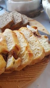 a pile of bread sitting on top of a plate at Hotel Boutique Il Castellino Relais in Vieste
