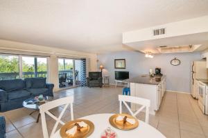 a living room with a couch and a table at Intercoastal Beach Suite in Clearwater