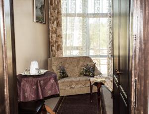 A seating area at City Center Kaķis B&B