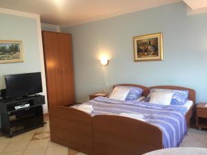 Ein Bett oder Betten in einem Zimmer der Unterkunft Apartment Villa Ana