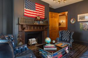 a living room with an american flag on the wall at The Hotel Portsmouth - Downtown in Portsmouth