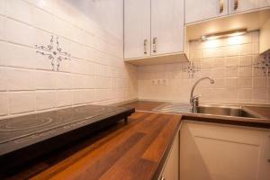 Kuchyň nebo kuchyňský kout v ubytování Apartments Mediteranea