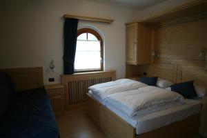 Posteľ alebo postele v izbe v ubytovaní B&B Rendena Chalet