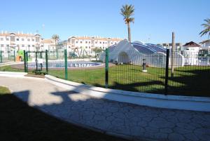 a park with a playground with at Taymar in Chiclana de la Frontera