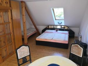 Postel nebo postele na pokoji v ubytování Ubytování u Máchova jezera - Apartmány - Ludmila Grulišová