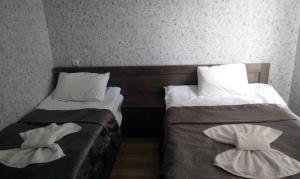 Rúm í herbergi á Hotel Mimino