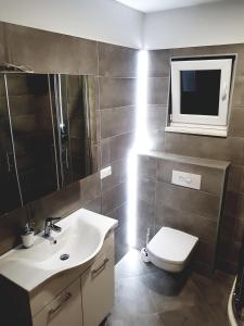 Kúpeľňa v ubytovaní Apartments Kalajica