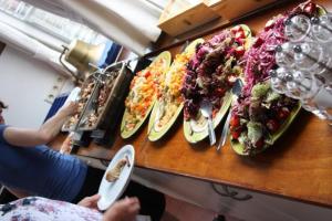 a counter with several plates of food on it at Hotelschip Gandalf in Amsterdam