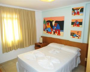 Cama o camas de una habitación en Flats em Ponta Negra, 1 e 2 qtos