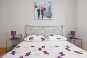 Ένα ή περισσότερα κρεβάτια σε δωμάτιο στο Beachfront Apartments Gabine