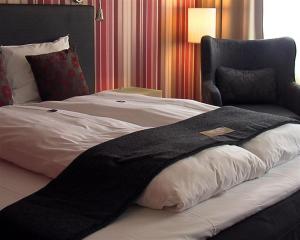 Letto o letti in una camera di First Hotel Witt