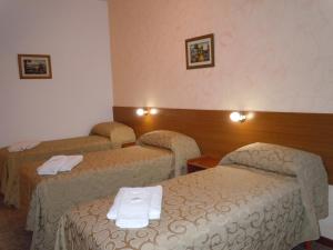 Postel nebo postele na pokoji v ubytování IRUPÉ APART HOTEL