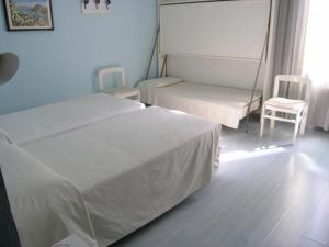 Postel nebo postele na pokoji v ubytování Elba Hotel