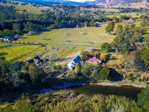 an aerial view of a farm and a river at Serendipity on Allyn in Allynbrook