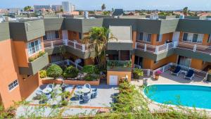 an aerial view of a building with a swimming pool at King David Suites in Palm-Eagle Beach