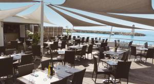 A restaurant or other place to eat at Ducal, Marina Baie des Anges