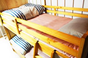 Postel nebo postele na pokoji v ubytování GUEST HOUSE SaKURa