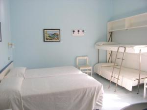 Postel nebo postele na pokoji v ubytování Elba Hotel