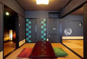 a room with a table in front of a door at Goyokan in Izu