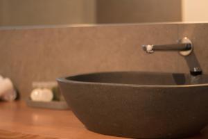 a black sink with a faucet on a counter at Ulverstone Waterfront Apartments in Ulverstone