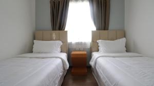 Posteľ alebo postele v izbe v ubytovaní Diyar Villas Puncak F4/8