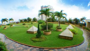 a model of a park with palm trees and a building at Lee Gardens Plaza Hotel - SHA Plus in Hat Yai