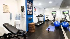 a gym with several exercise bikes and a treadmill at Best Western McCarran Inn in Las Vegas