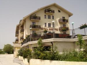 a large building with balconies on the side of it at Hotel Cristal in Roccaraso