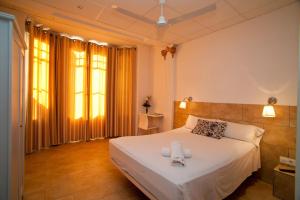 Posteľ alebo postele v izbe v ubytovaní Hostal Martinval + 37 fotografií