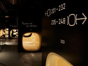 a rendering of a train on display in a room at 9h nine hours Akasaka in Tokyo