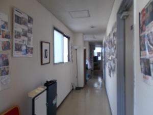 a hallway of a room with a long hallway sidx sidx sidx at Hotel Avanti in Tokushima