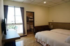 TV a/nebo společenská místnost v ubytování ChangJu Hotel-附免費停車位 + 27 fotografií