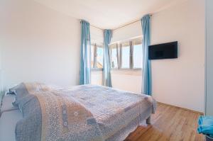 Posteľ alebo postele v izbe v ubytovaní Apartman Nella