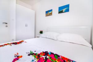 Posteľ alebo postele v izbe v ubytovaní Apartman Nella