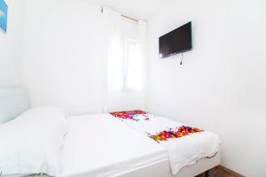 Posteľ alebo postele v izbe v ubytovaní Apartman Nella