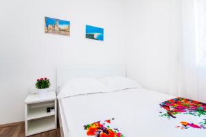 Posteľ alebo postele v izbe v ubytovaní Apartman Nella