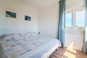Posteľ alebo postele v izbe v ubytovaní Apartman Nella