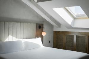 En eller flere senge i et værelse på ICON Wipton