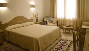 Postel nebo postele na pokoji v ubytování Hotel Libyssonis